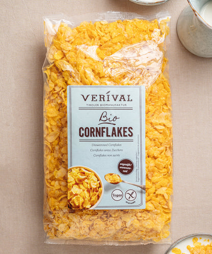 Auf einem Tisch steht eine Packung Cornflakes ungesüßt von Verival Bio, gekennzeichnet als ungesüßt und vegan.